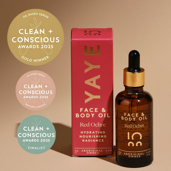 YAYE Face & Body Oil with packaging and awards on a beige background