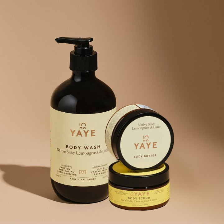 Yaye body care products including body wash, body butter, and body scrub on a beige background