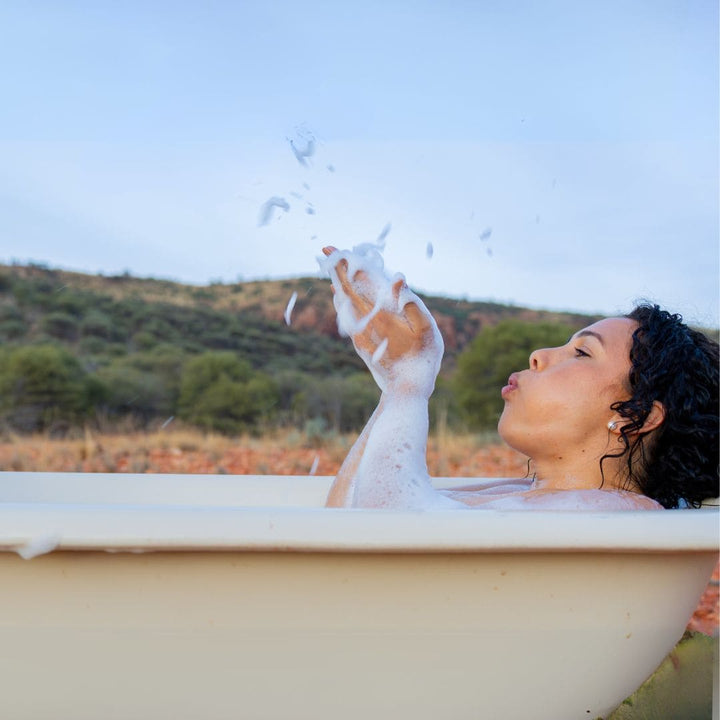 Relaxing soak using Yaye Berrigan Bubble Bath on Country, inspired by native Australian botanicals and Aboriginal bush medicine traditions