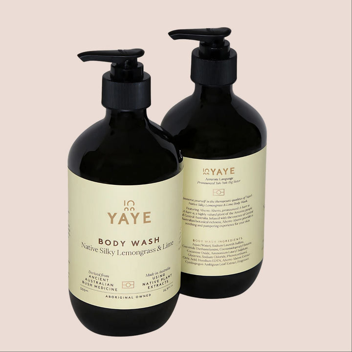Two black bottles of YAYE body wash on a beige background