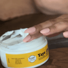 Aboriginal product being placed on body. Body butter moisturiser on skin.  Aboriginal skin care product