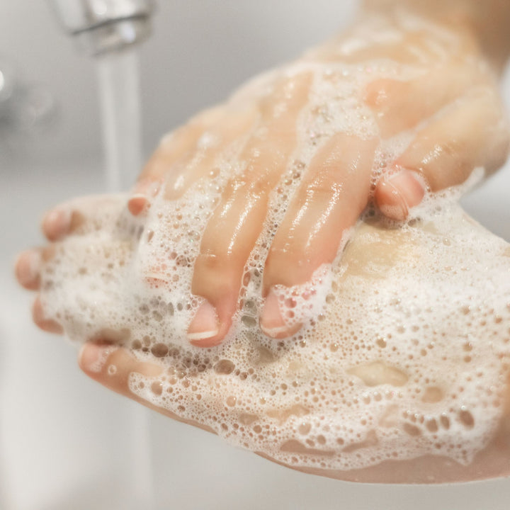 Washing hands with Yaye hand wash