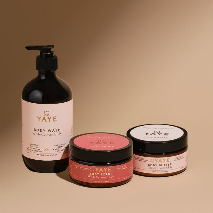 YAYE body care products including body wash, scrub, and butter on a beige background
