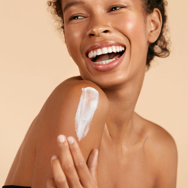 Woman applying Yaye Lemongrass & Lime Body Butter – natural hydration for soft, glowing skin
